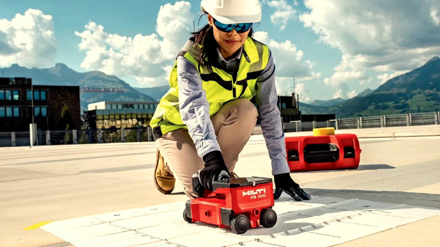 Operative using Hilti PS300 to scan an outdoor concrete structure for structural assessment