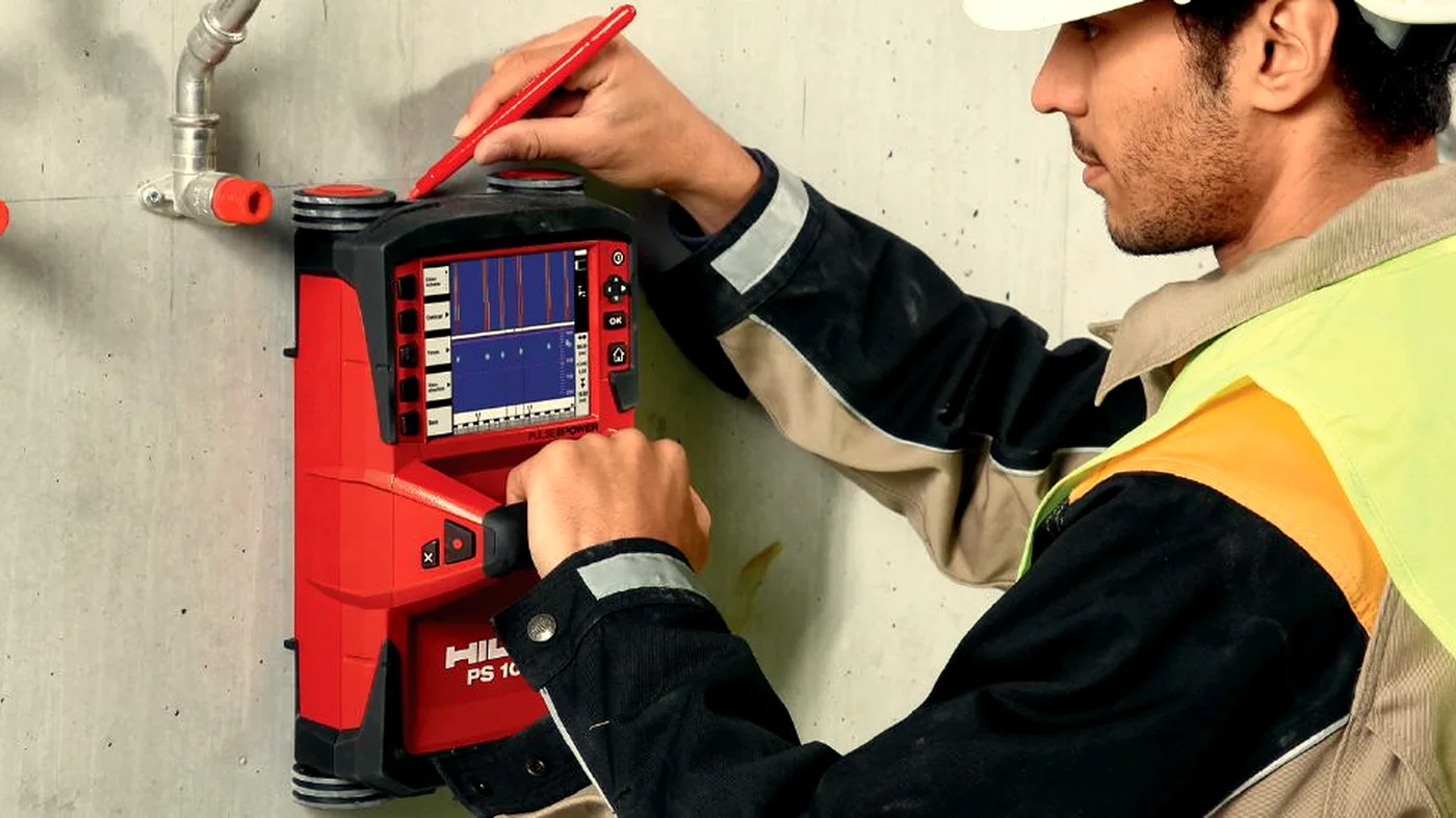 Engineer reviewing concrete scan data output on a Hilti scanner display