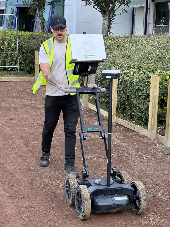 Surveyor with the GPR cart and GNSS mast