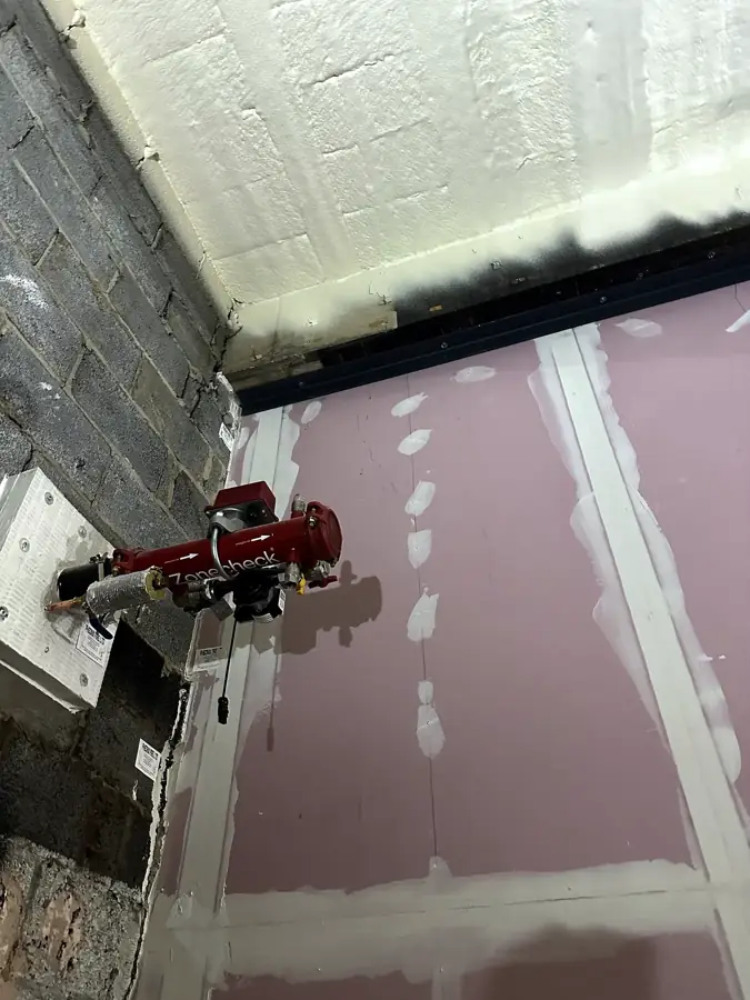 Rig-mounted drill on a wall